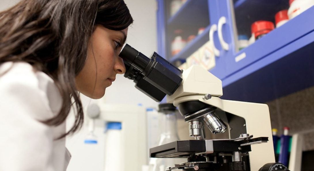 student and microscope