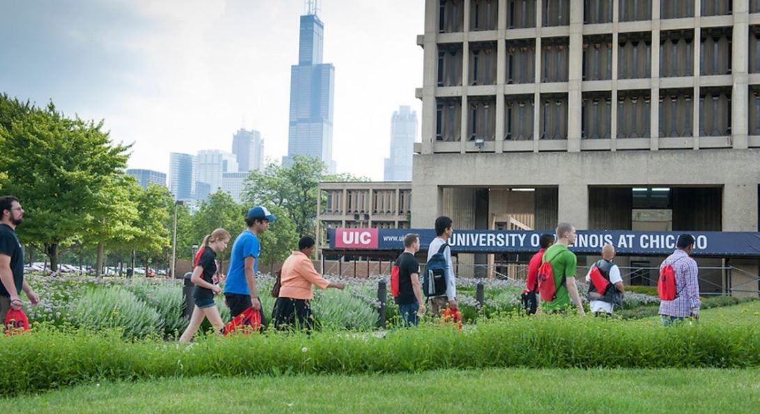 Student walking towards University Hall